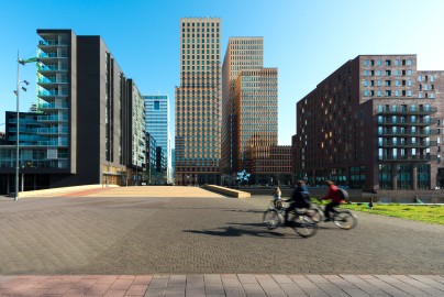 Office buildings in Amsterdam Zuid, Amsterdam, Netherlands. People bicycling in Amsterdam, Netherlands